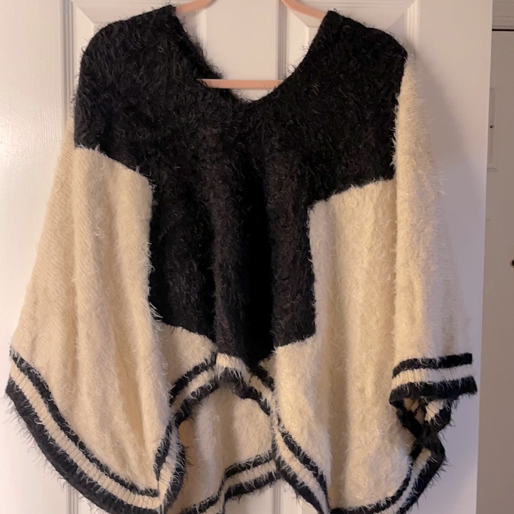 White and black poncho